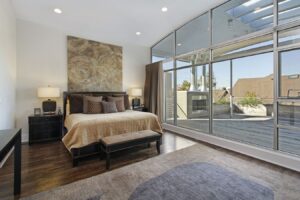 large bedroom with floor to ceiling windows frantz home additions